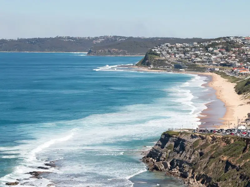 Bar Beach and Merewether in Newcastle from the clifftop, with surf rolling in.
