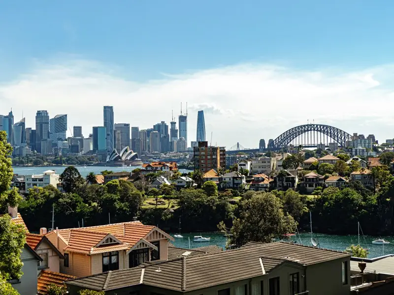 Sydney’s skyline, the Opera House and the Harbour Bridge across the harbour from Cremorne Point.
