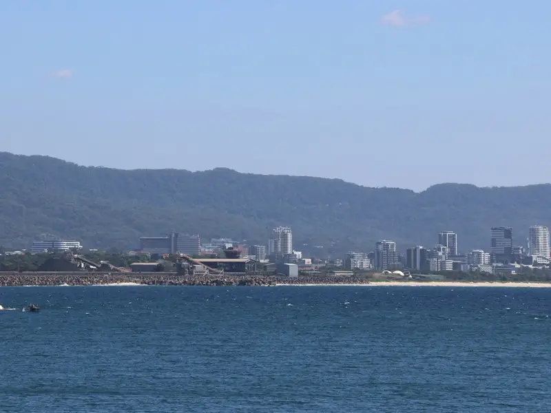 Wollongong’s city centre beneath the Illawarra Escarpment and Mount Keira, across the water.