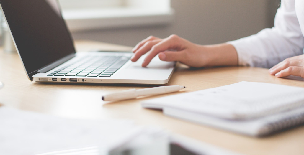 a person doing online bookkeeping on a computer