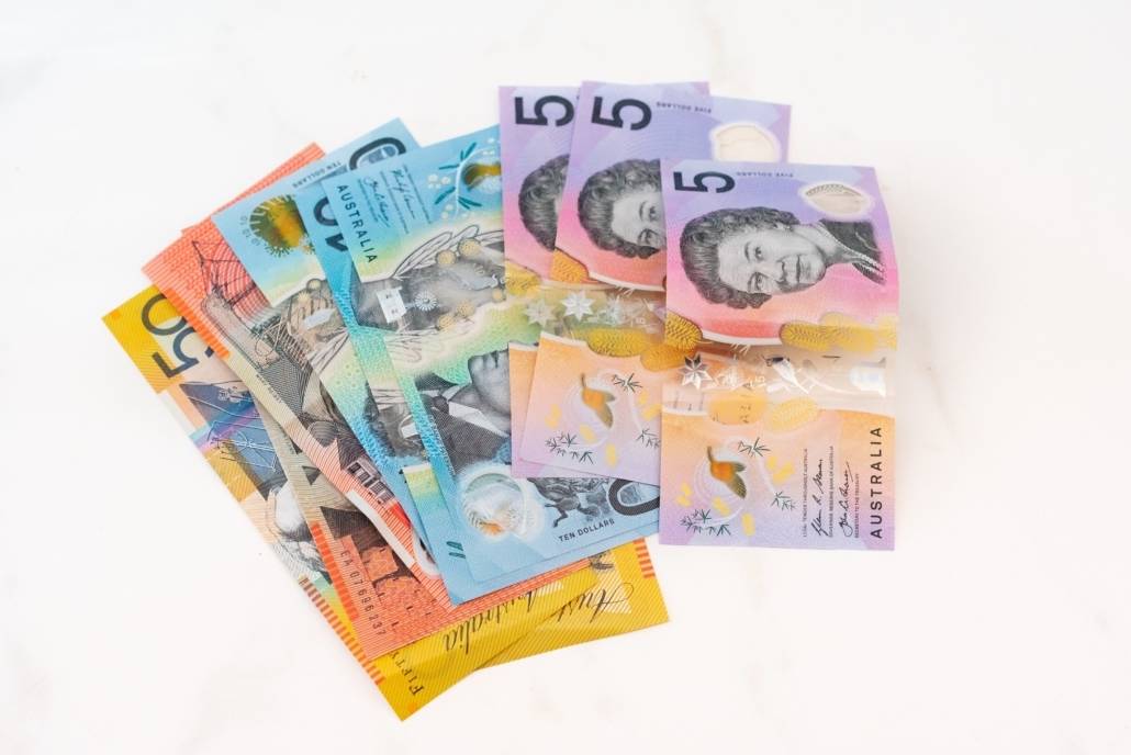 few Australian bank notes (AUD) fanned pout against a white background
