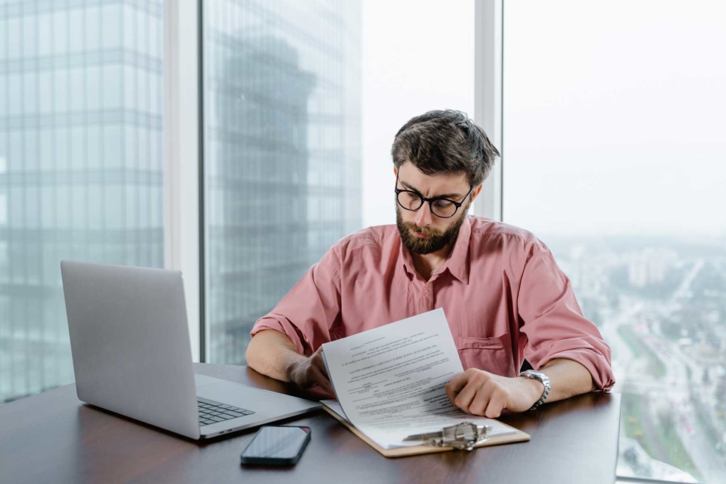 A bookkeeper looks over a bank reconciliation statement.