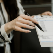 Woman holding accounts payable invoice