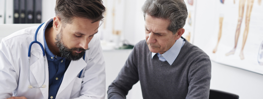 Men working on bookkeeping for a medical practice