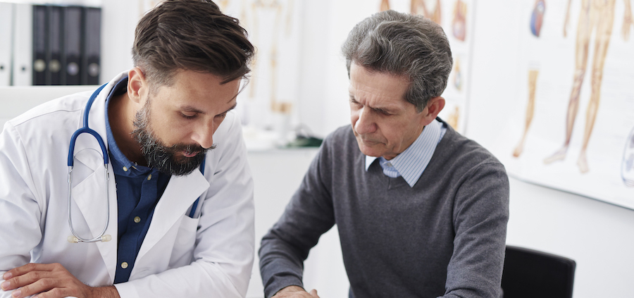Men working on bookkeeping for a medical practice