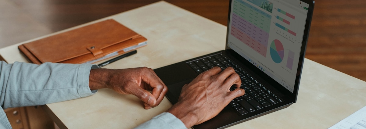 Person reviewing financial figures on a laptop dashboard
