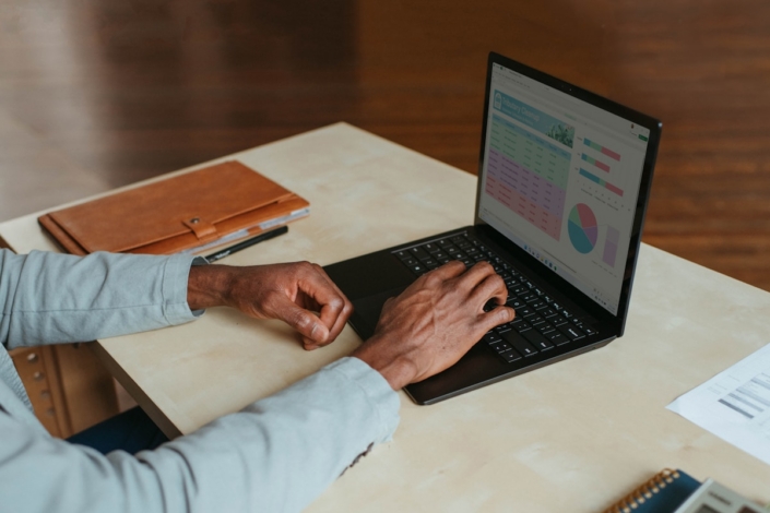 Person reviewing financial figures on a laptop dashboard